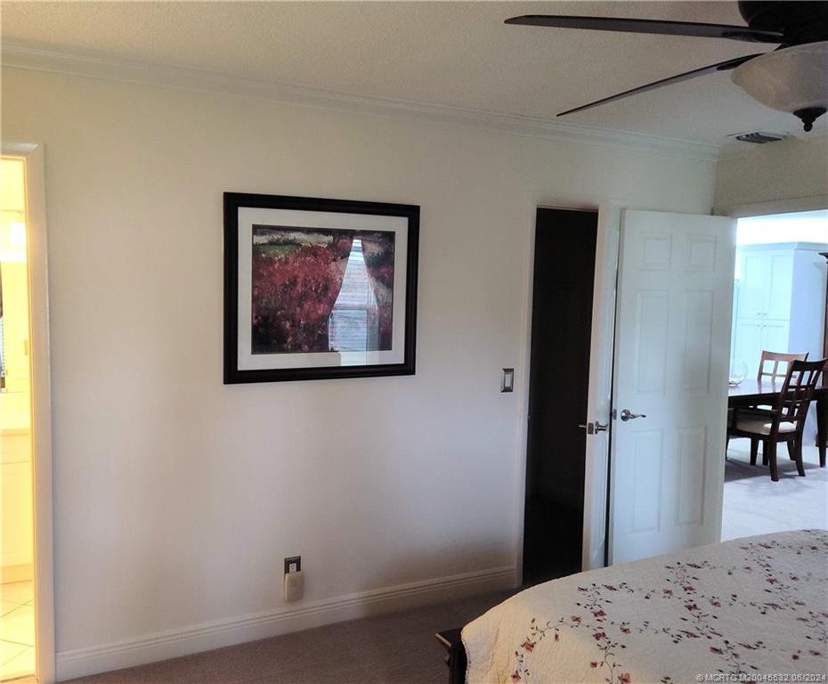 Undisclosed Address Stuart, FL 34997 - Photo 26 of 64 a bedroom with a bed and a window