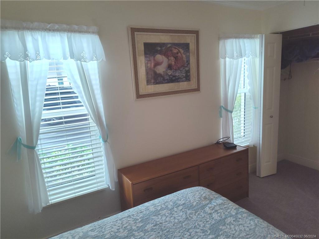 Undisclosed Address Stuart, FL 34997 - Photo 32 of 64 a view of wooden floor and windows in a room