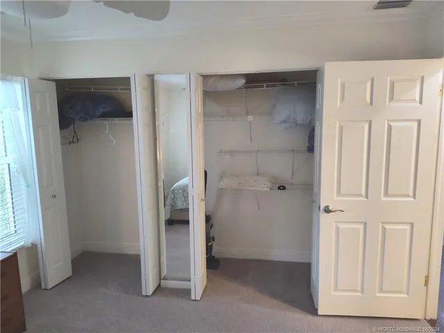 a view of storage and utility room with washer and dryer