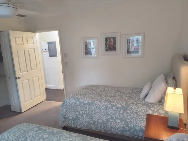 a view of a room with furniture and a window