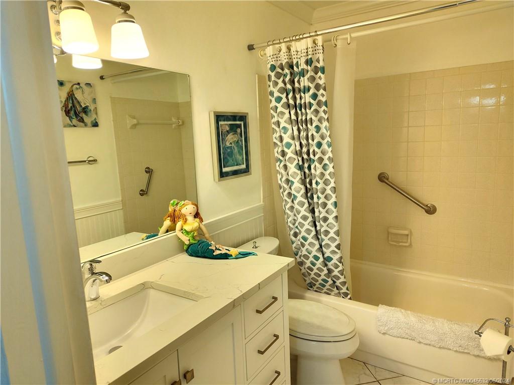 Undisclosed Address Stuart, FL 34997 - Photo 38 of 64 a bathroom with a sink toilet and shower