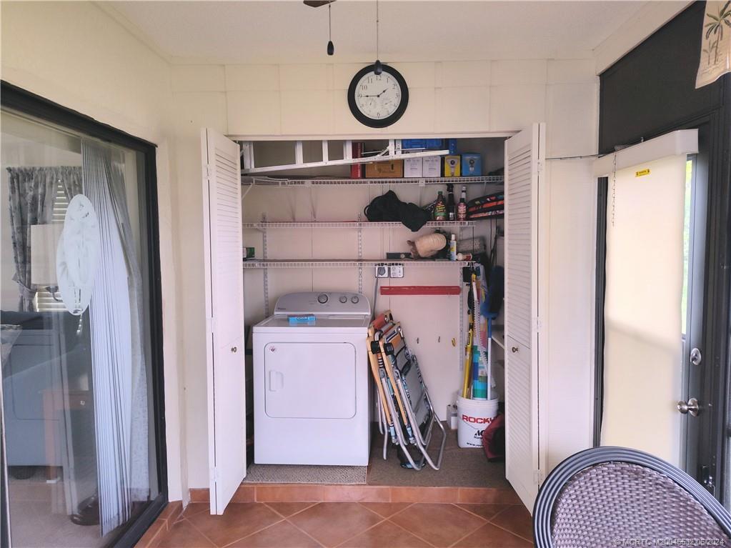 Undisclosed Address Stuart, FL 34997 - Photo 42 of 64 a view of storage and utility room with washer and dryer