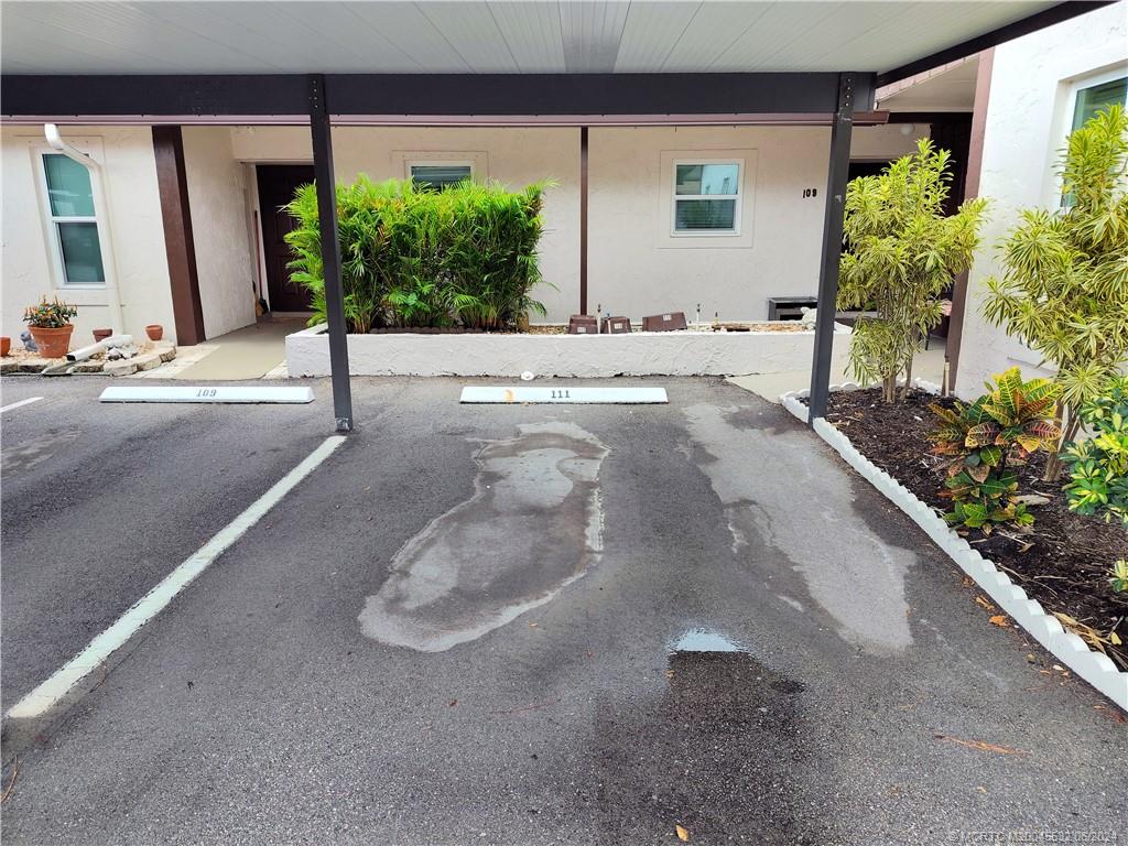 Undisclosed Address Stuart, FL 34997 - Photo 48 of 64 a view of a house with a backyard