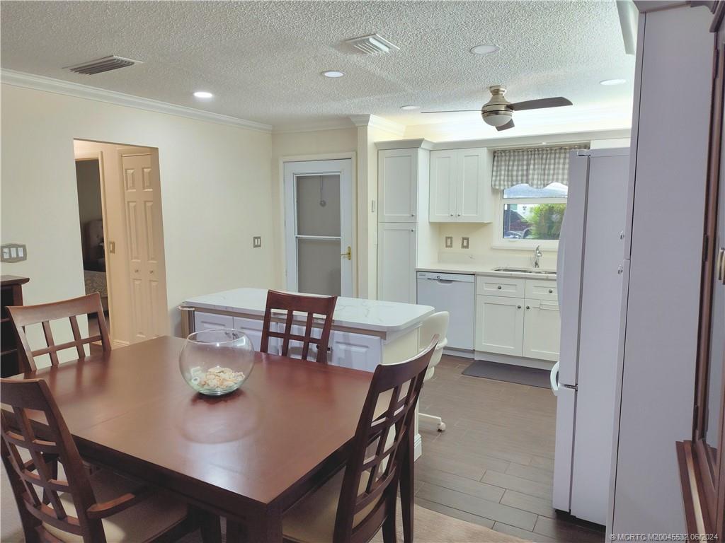 Undisclosed Address Stuart, FL 34997 - Photo 10 of 64 a view of a dining room with furniture and wooden floor
