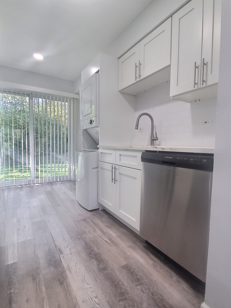 228 East Rimini Court Palatine, IL 60067 - Photo 9 of 24 a view of a kitchen with a sink cabinets and a window