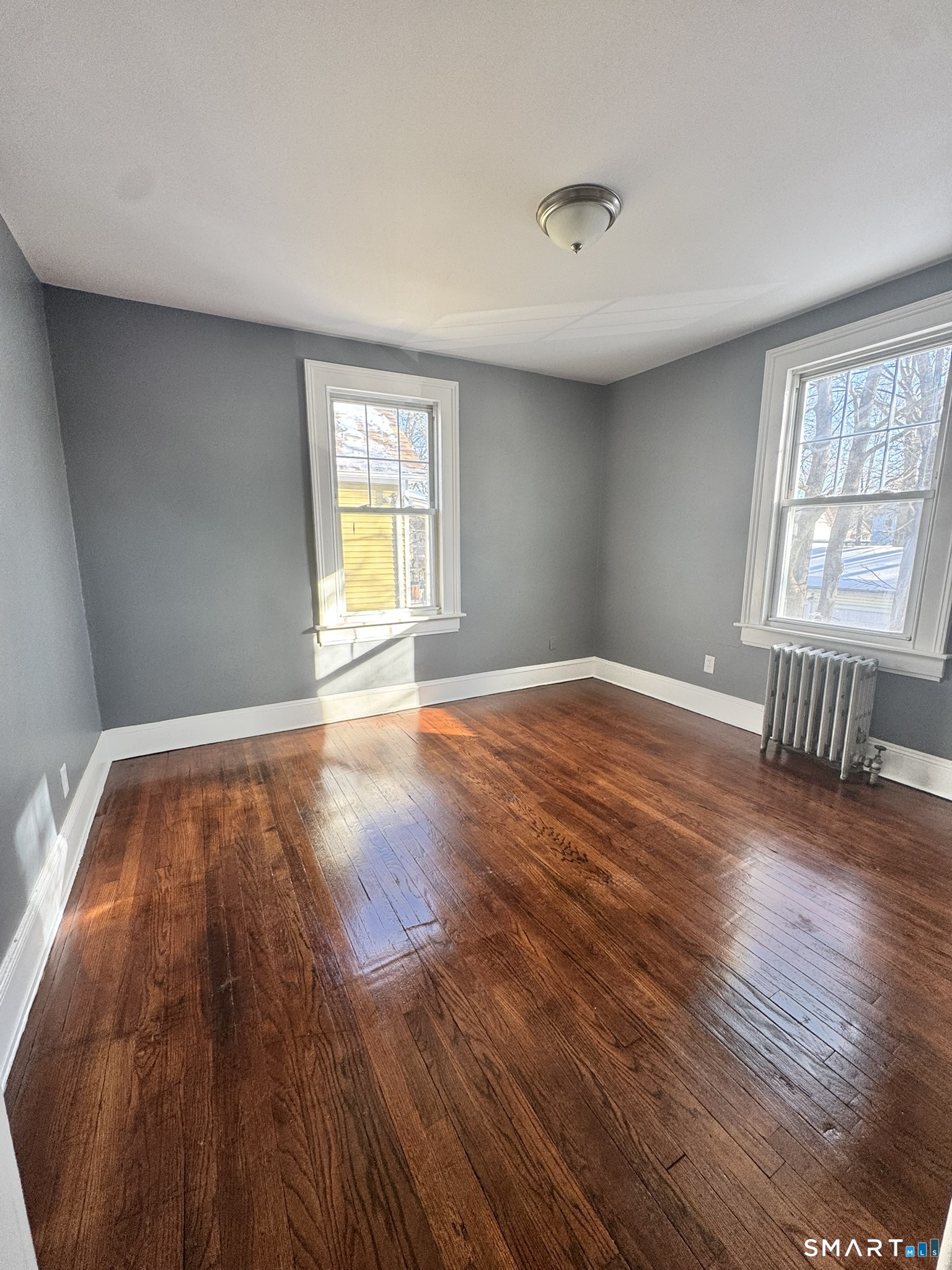 26 Lander Street New Haven, CT 06511 - Photo 13 of 26 a view of an empty room with wooden floor and a window