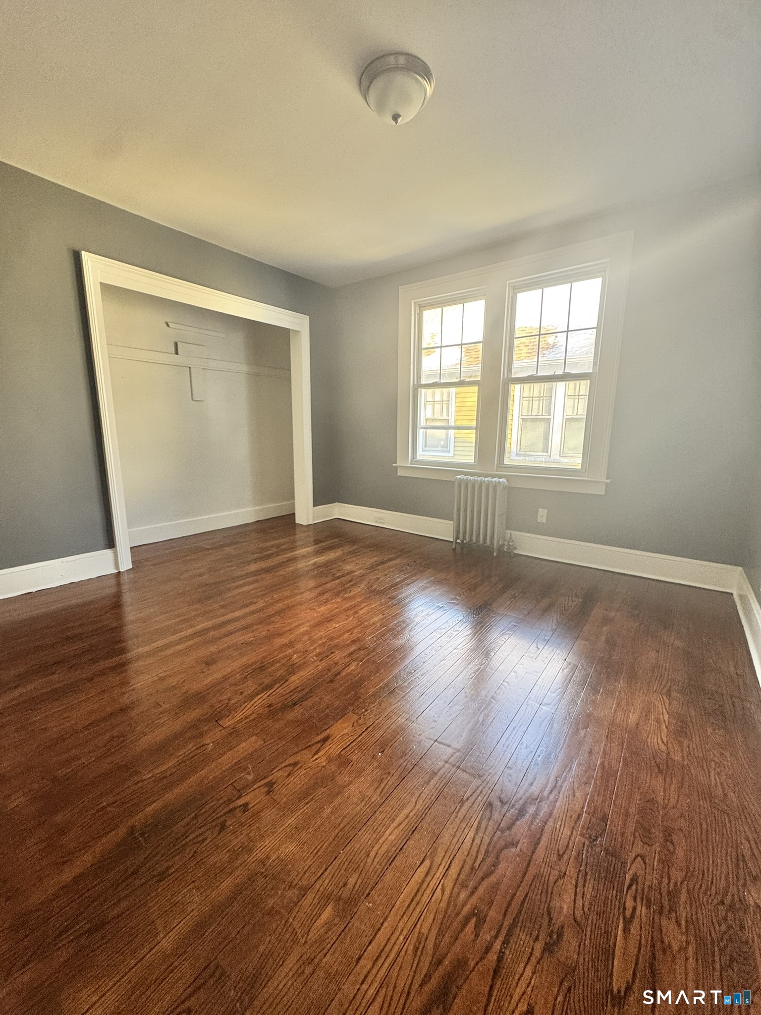 26 Lander Street New Haven, CT 06511 - Photo 14 of 26 an empty room with wooden floor and windows