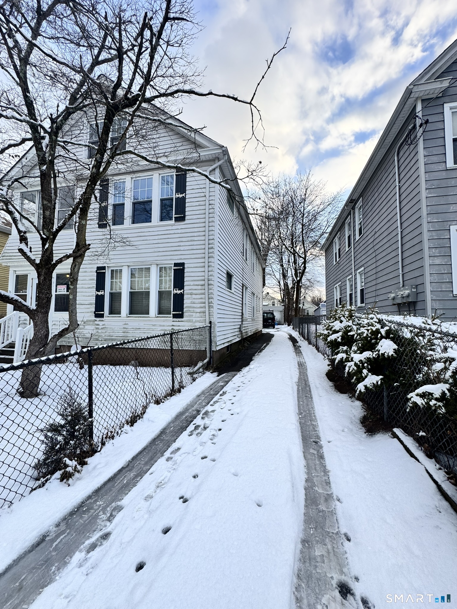 26 Lander Street New Haven, CT 06511 - Photo 2 of 26 a view of a house with a yard covered in snow