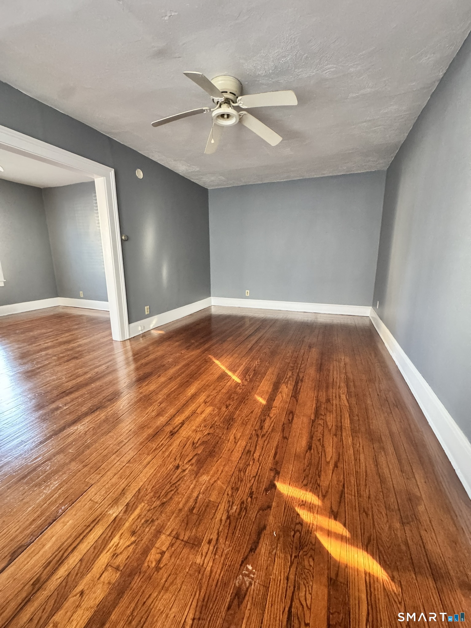 26 Lander Street New Haven, CT 06511 - Photo 3 of 26 a view of a livingroom with wooden floor and a ceiling fan