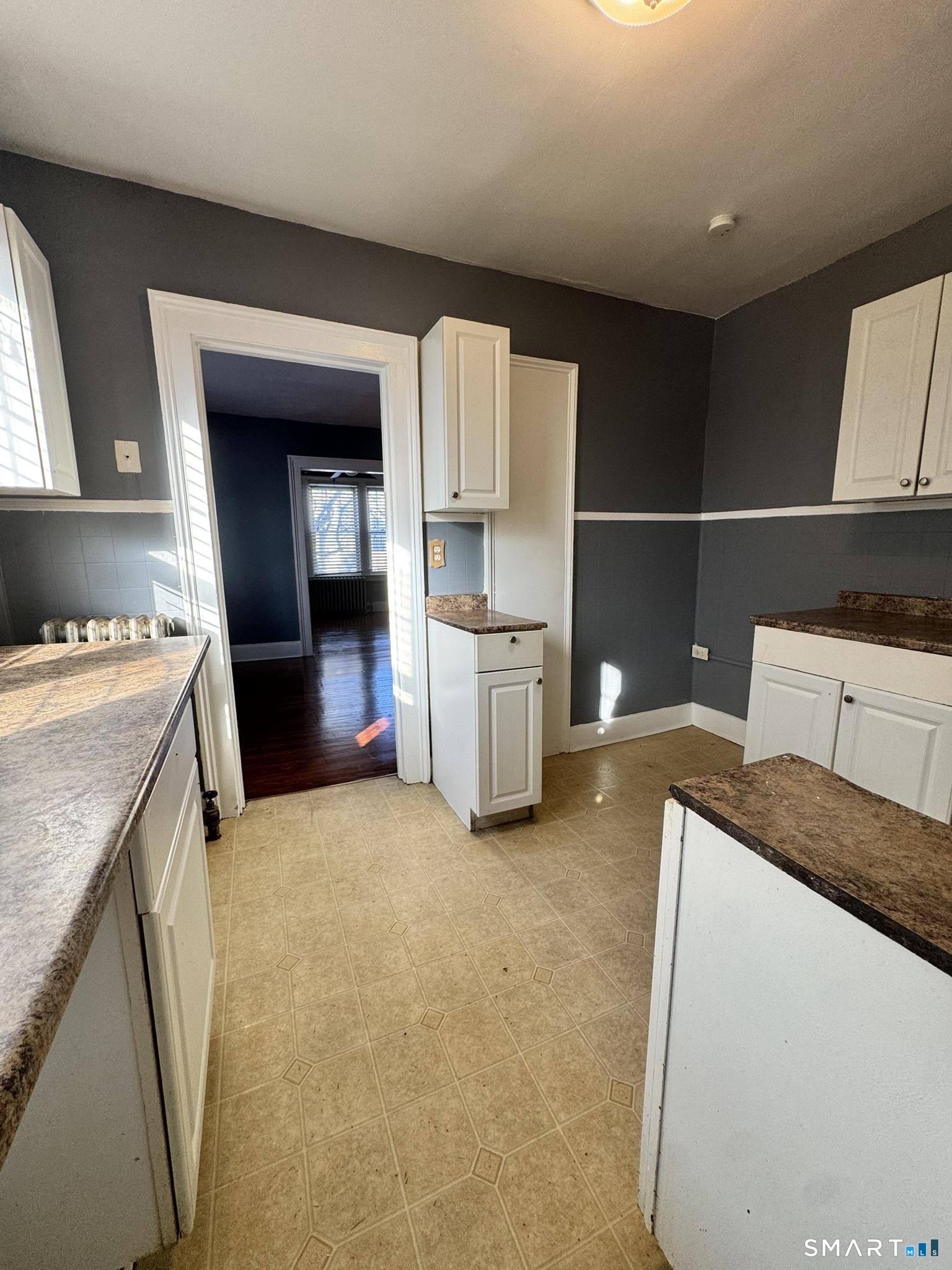 26 Lander Street New Haven, CT 06511 - Photo 5 of 26 a kitchen with a sink and a refrigerator