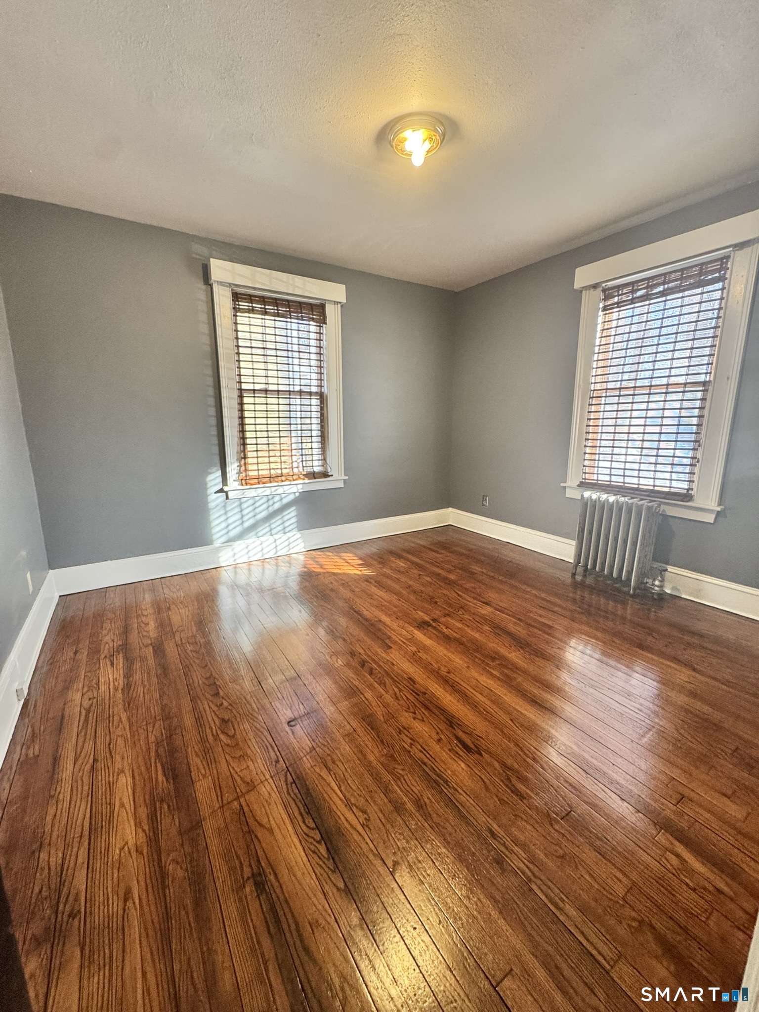 26 Lander Street New Haven, CT 06511 - Photo 7 of 26 wooden floor in an empty room with a window