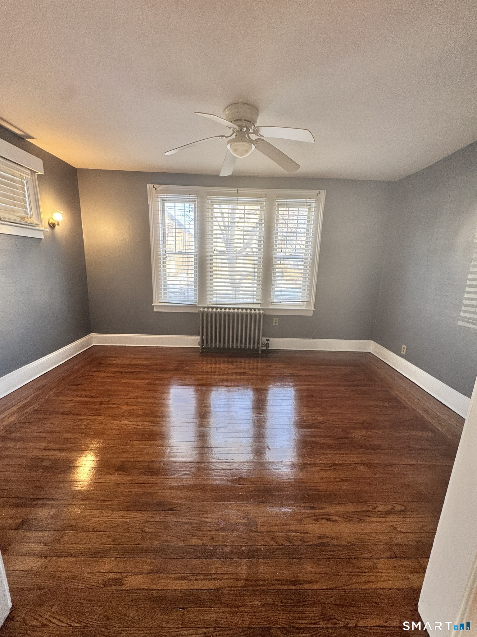 26 Lander Street New Haven, CT 06511 - Photo 9 of 26 a view of empty room with wooden floor and fan