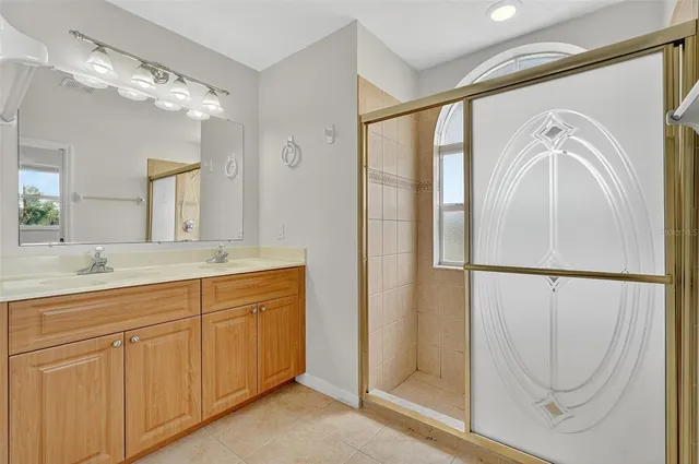 a bathroom with a double vanity sink and mirror
