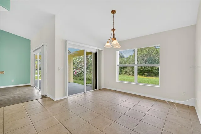 a view of an empty room with windows