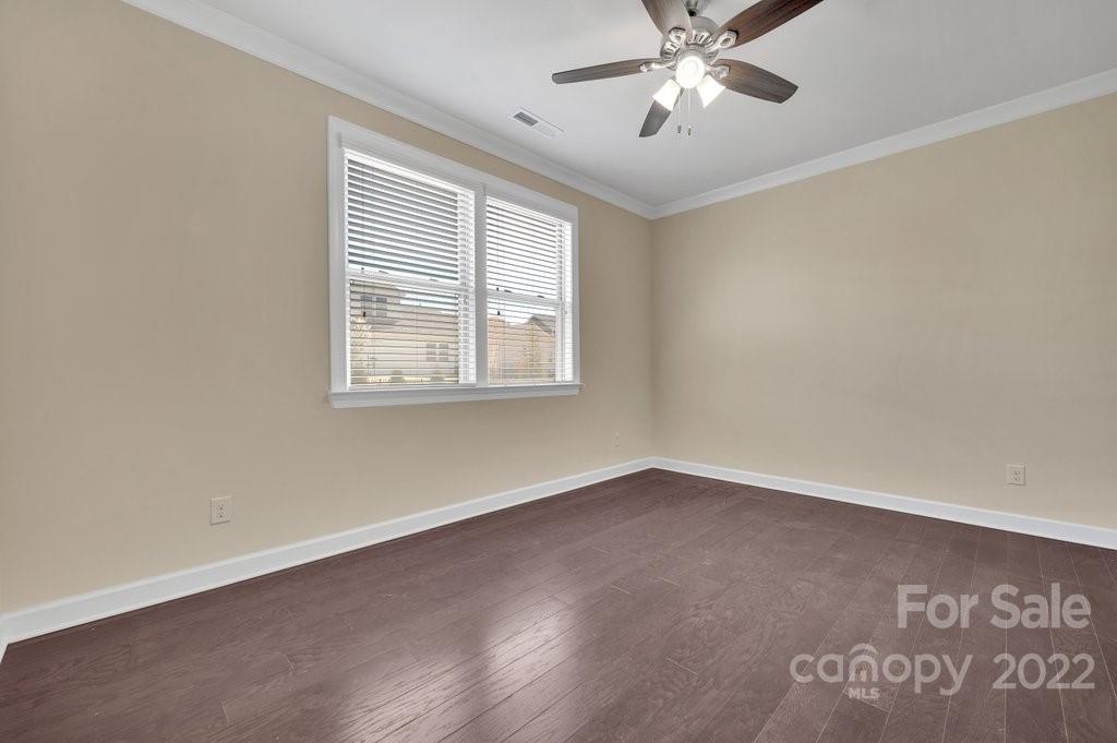 1271 Independence Street Tega Cay, SC 29708 - Photo 13 of 23 an empty room with a window and a ceiling fan