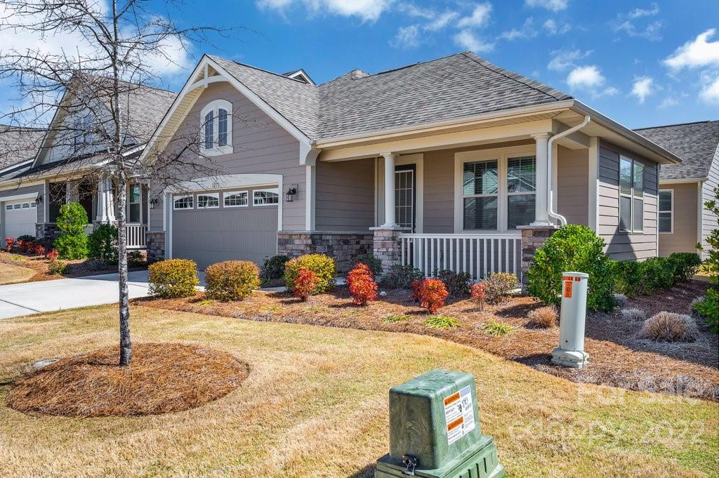 1271 Independence Street Tega Cay, SC 29708 - Photo 2 of 23 a front view of a house with garden