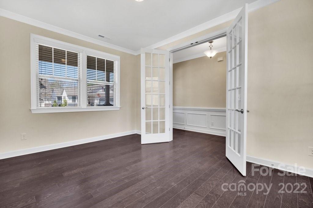1271 Independence Street Tega Cay, SC 29708 - Photo 5 of 23 an empty room with wooden floor and windows