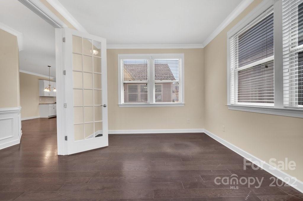 1271 Independence Street Tega Cay, SC 29708 - Photo 6 of 23 an empty room with wooden floor and windows