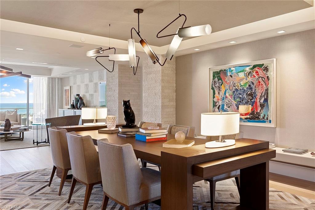 6897 Grenadier Boulevard, Unit 902 Naples, FL 34108 - Photo 2 of 50 a view of a dining room with furniture