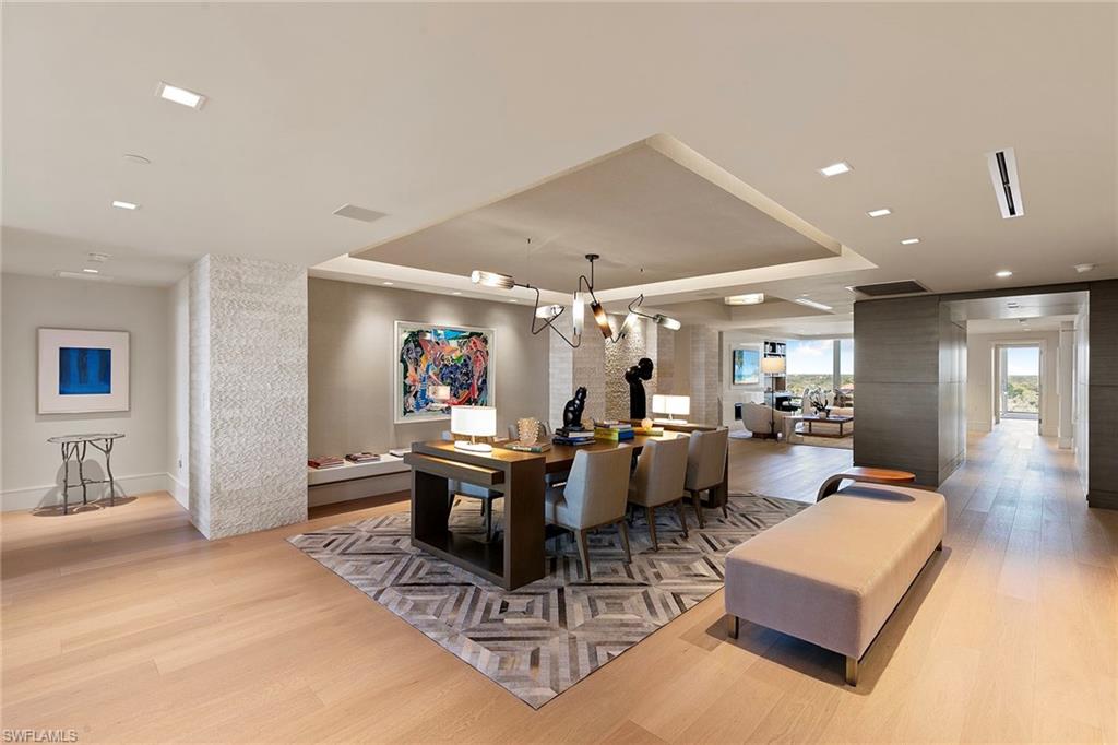 6897 Grenadier Boulevard, Unit 902 Naples, FL 34108 - Photo 4 of 50 a living room with furniture and a large window