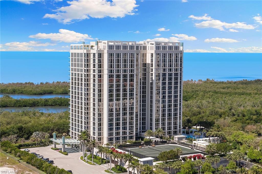 6897 Grenadier Boulevard, Unit 902 Naples, FL 34108 - Photo 45 of 50 a view of a city with tall buildings
