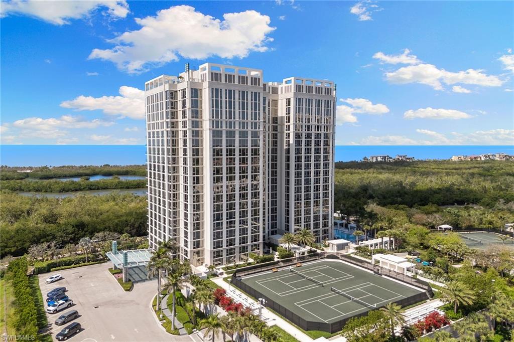 6897 Grenadier Boulevard, Unit 902 Naples, FL 34108 - Photo 46 of 50 a view of a patio with a table and chairs