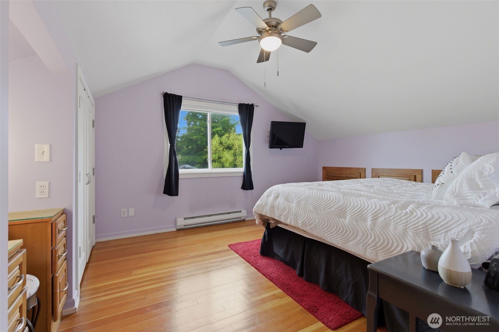 9272 Fauntleroy Way Southwest Seattle, WA 98136 - Photo 17 of 35 a bed room with a bed window and a chandelier