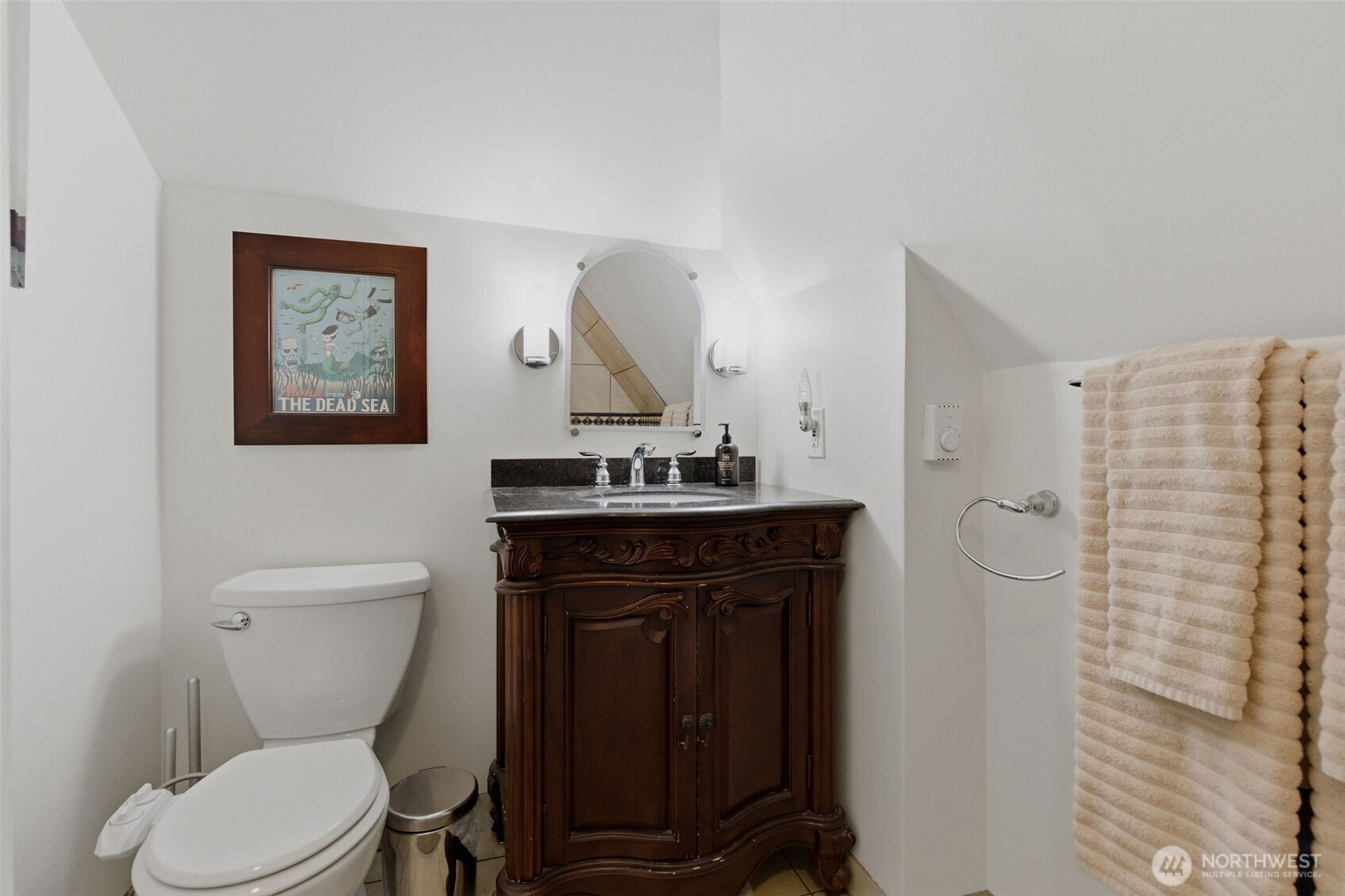 9272 Fauntleroy Way Southwest Seattle, WA 98136 - Photo 19 of 35 a bathroom with a toilet a sink and mirror