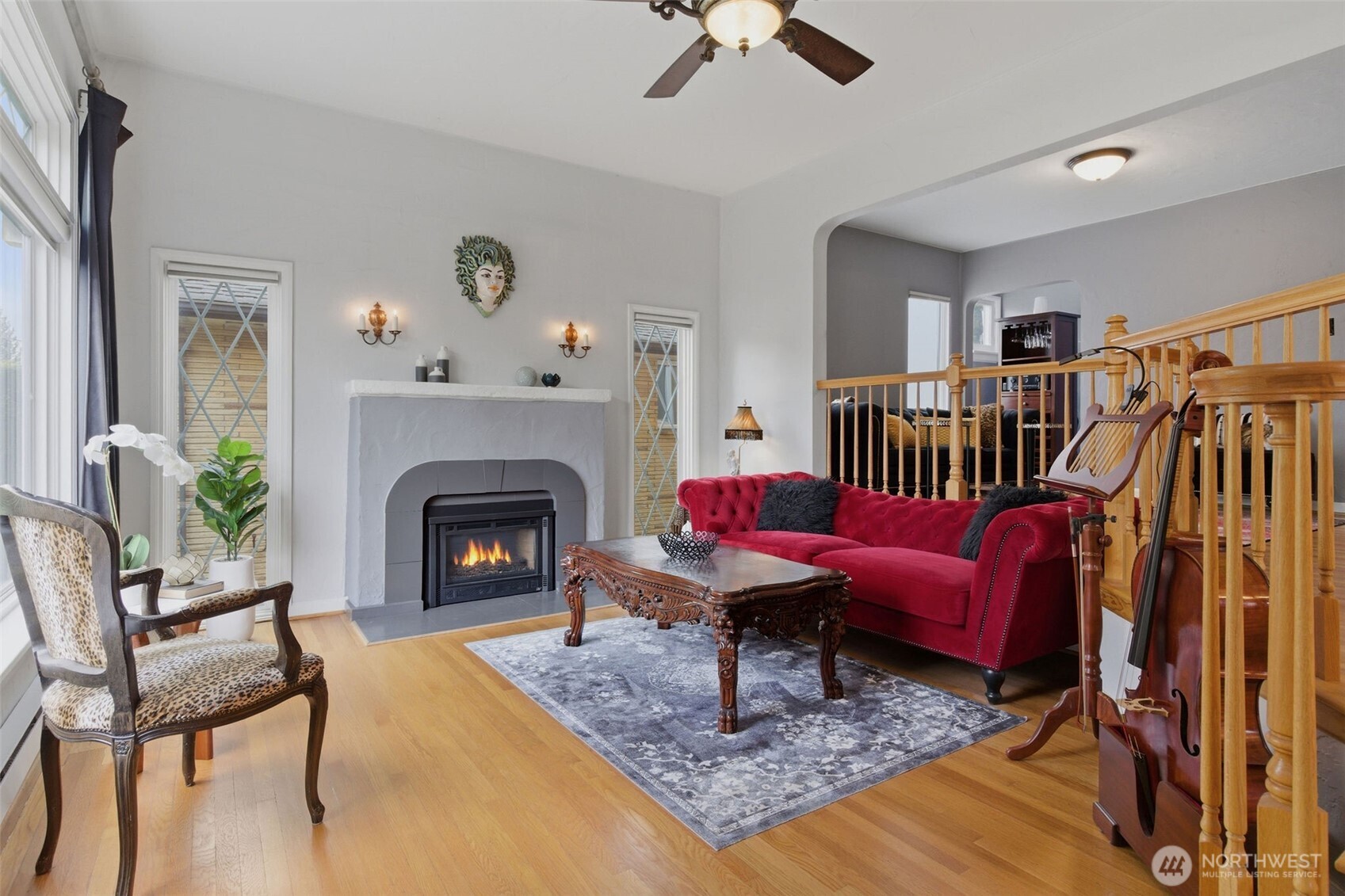 9272 Fauntleroy Way Southwest Seattle, WA 98136 - Photo 2 of 35 a living room with furniture rug and a fireplace
