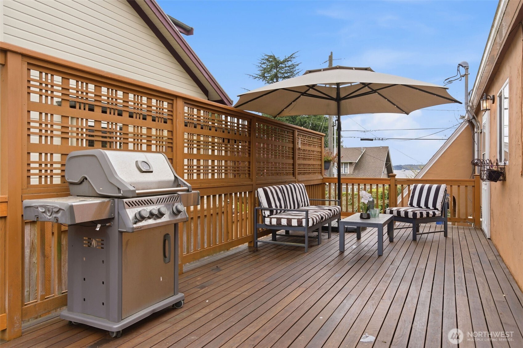 9272 Fauntleroy Way Southwest Seattle, WA 98136 - Photo 27 of 35 a view of a balcony with furniture and wooden floor
