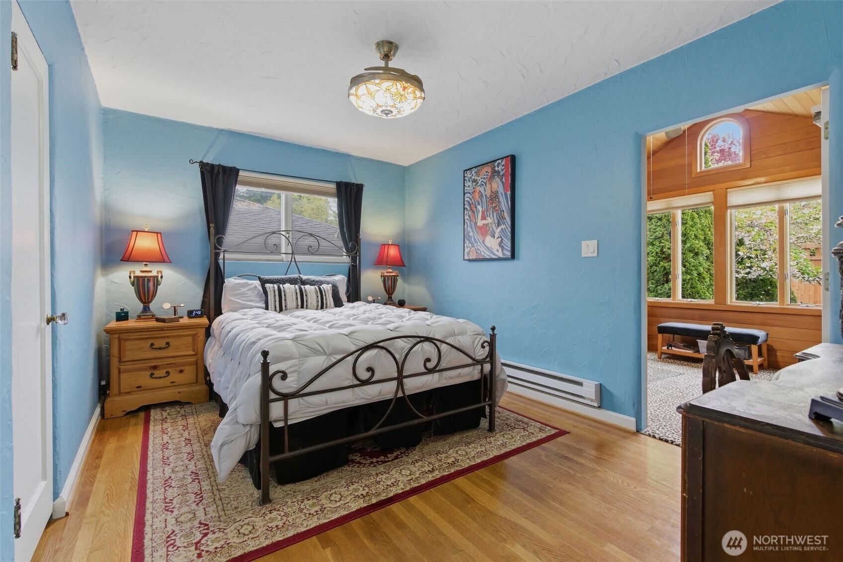 9272 Fauntleroy Way Southwest Seattle, WA 98136 - Photo 10 of 35 a bed sitting in a bedroom next to a window
