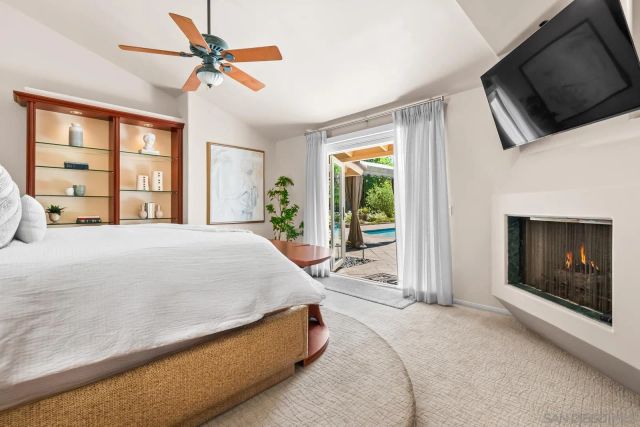 a bathroom with a double vanity sink mirror and shower
