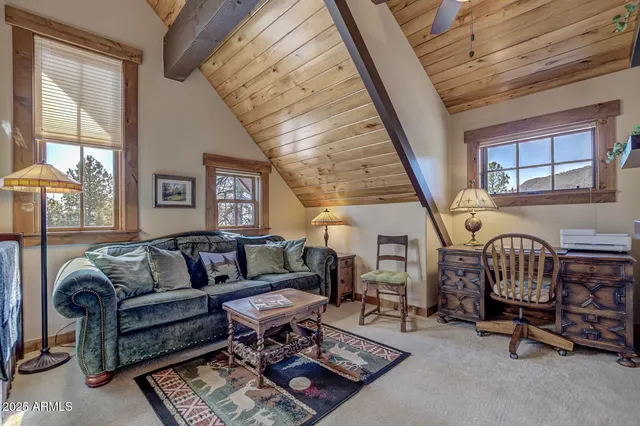 a bedroom with a large bed and a large window
