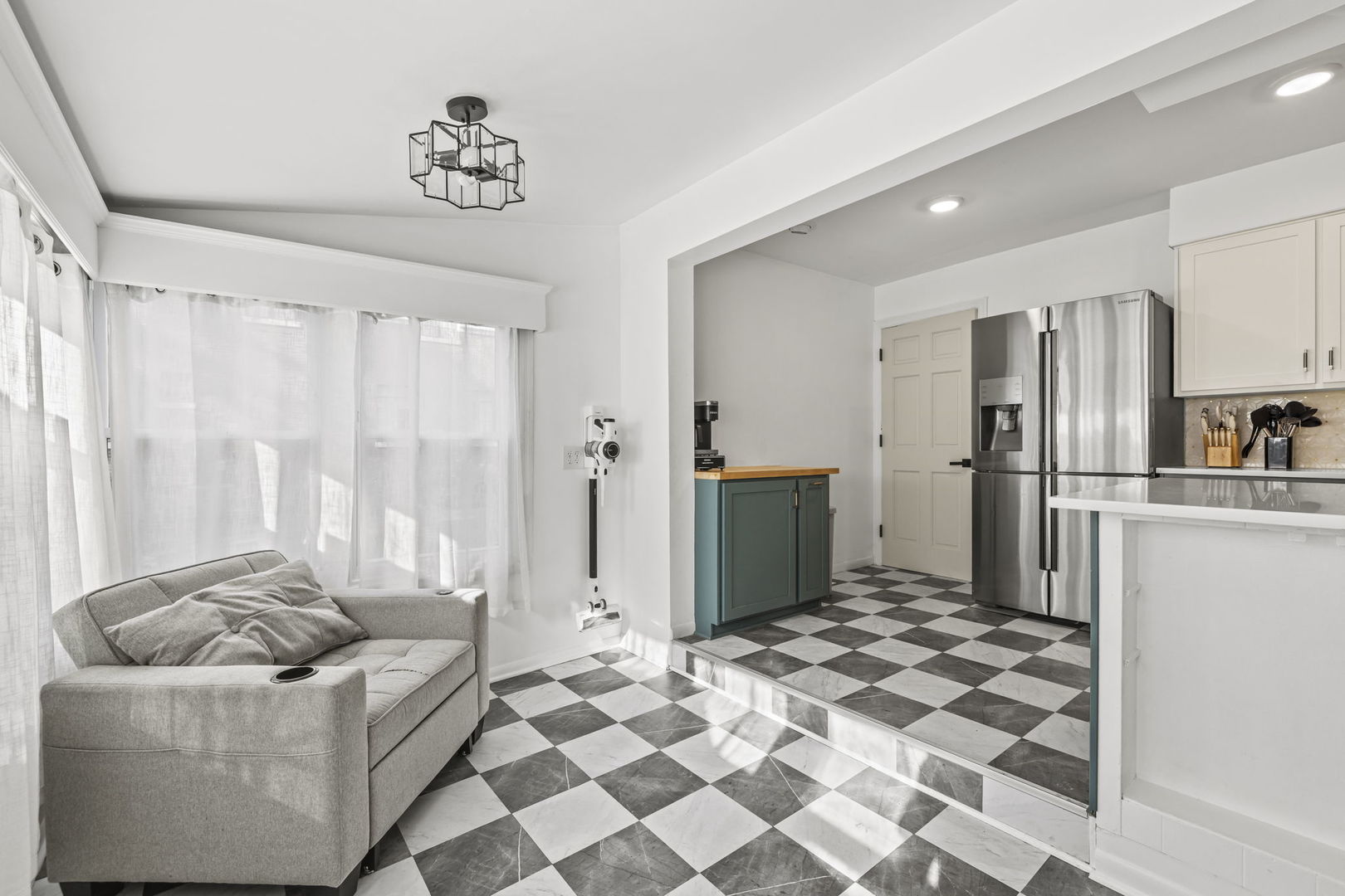 620 Crest Street Wheaton, IL 60187 - Photo 17 of 44 a living room with a couch and a refrigerator