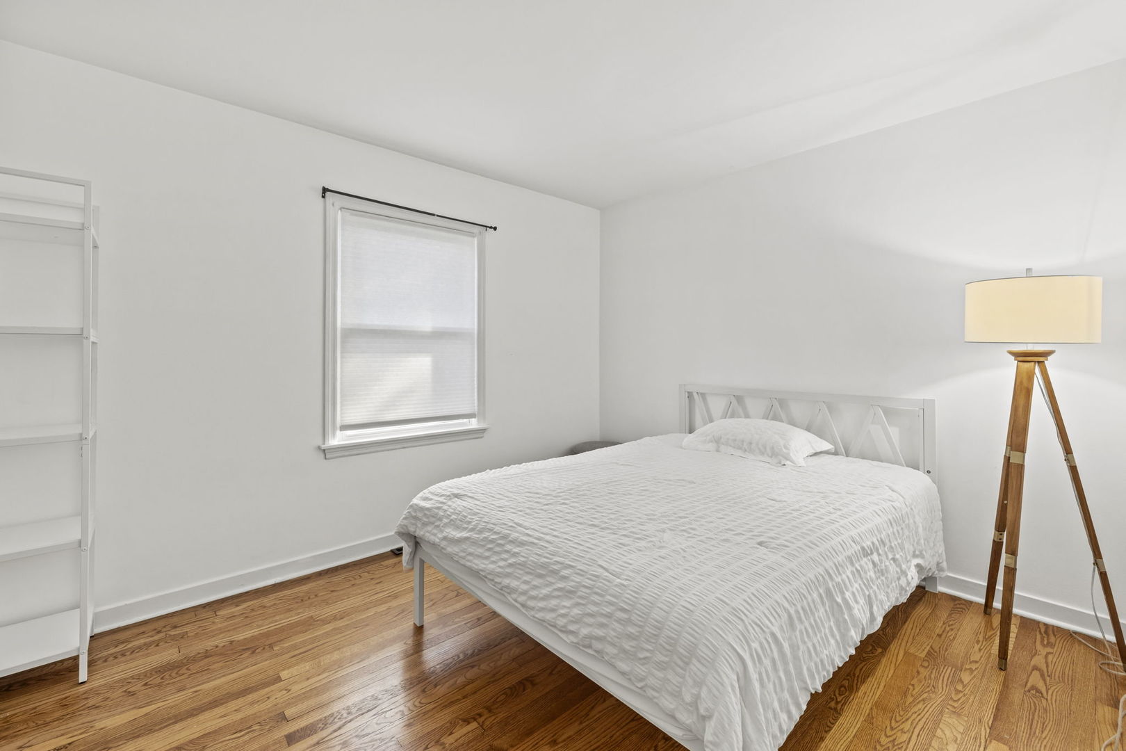 620 Crest Street Wheaton, IL 60187 - Photo 22 of 44 a bedroom with a bed and a wooden floor