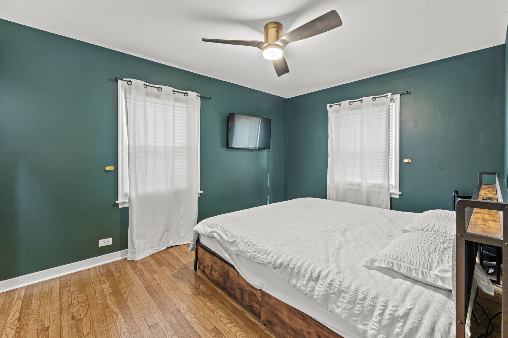 620 Crest Street Wheaton, IL 60187 - Photo 23 of 44 a bedroom with a bed and a chandelier