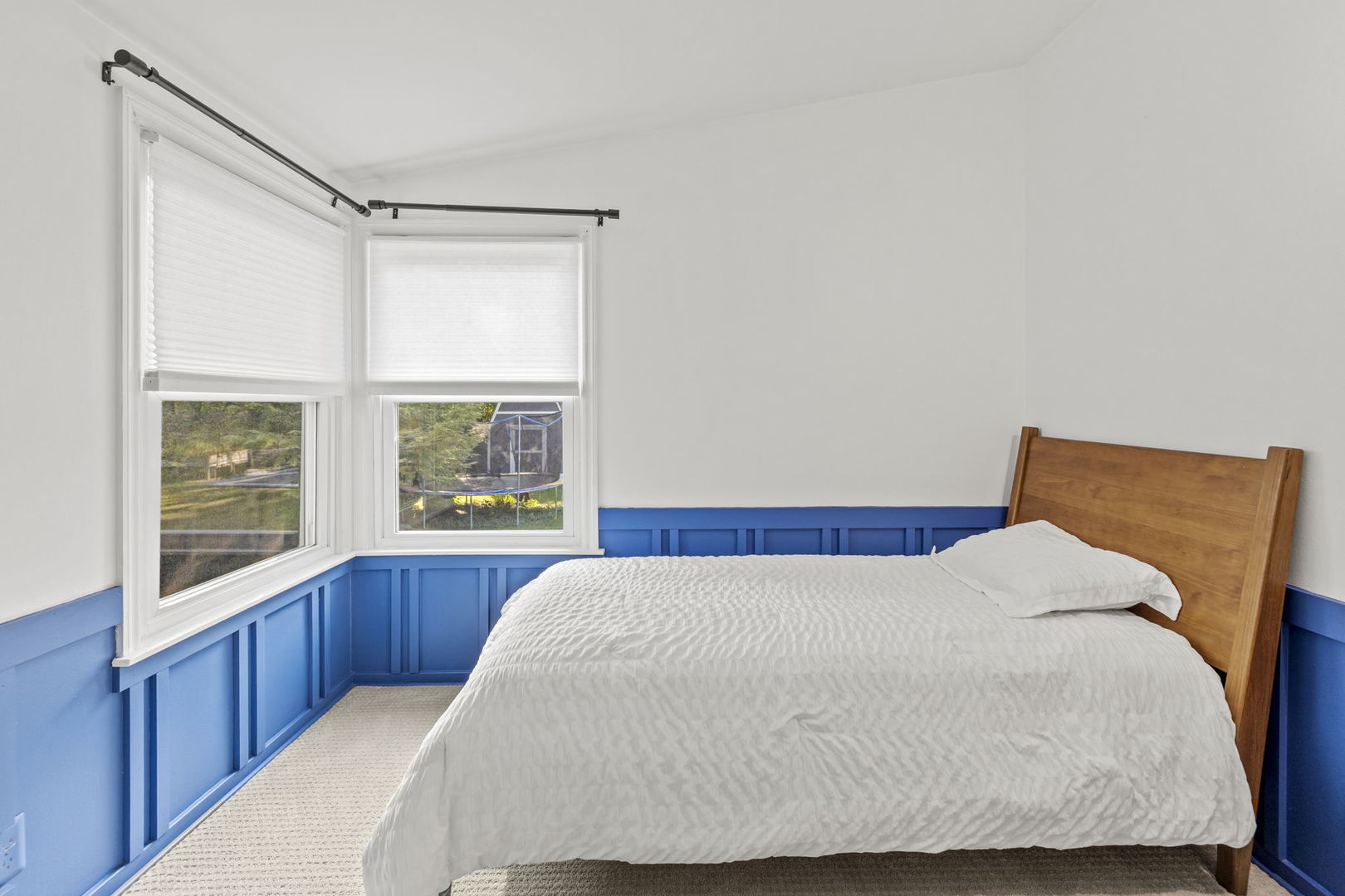 620 Crest Street Wheaton, IL 60187 - Photo 30 of 44 a bedroom with a bed and wooden floor