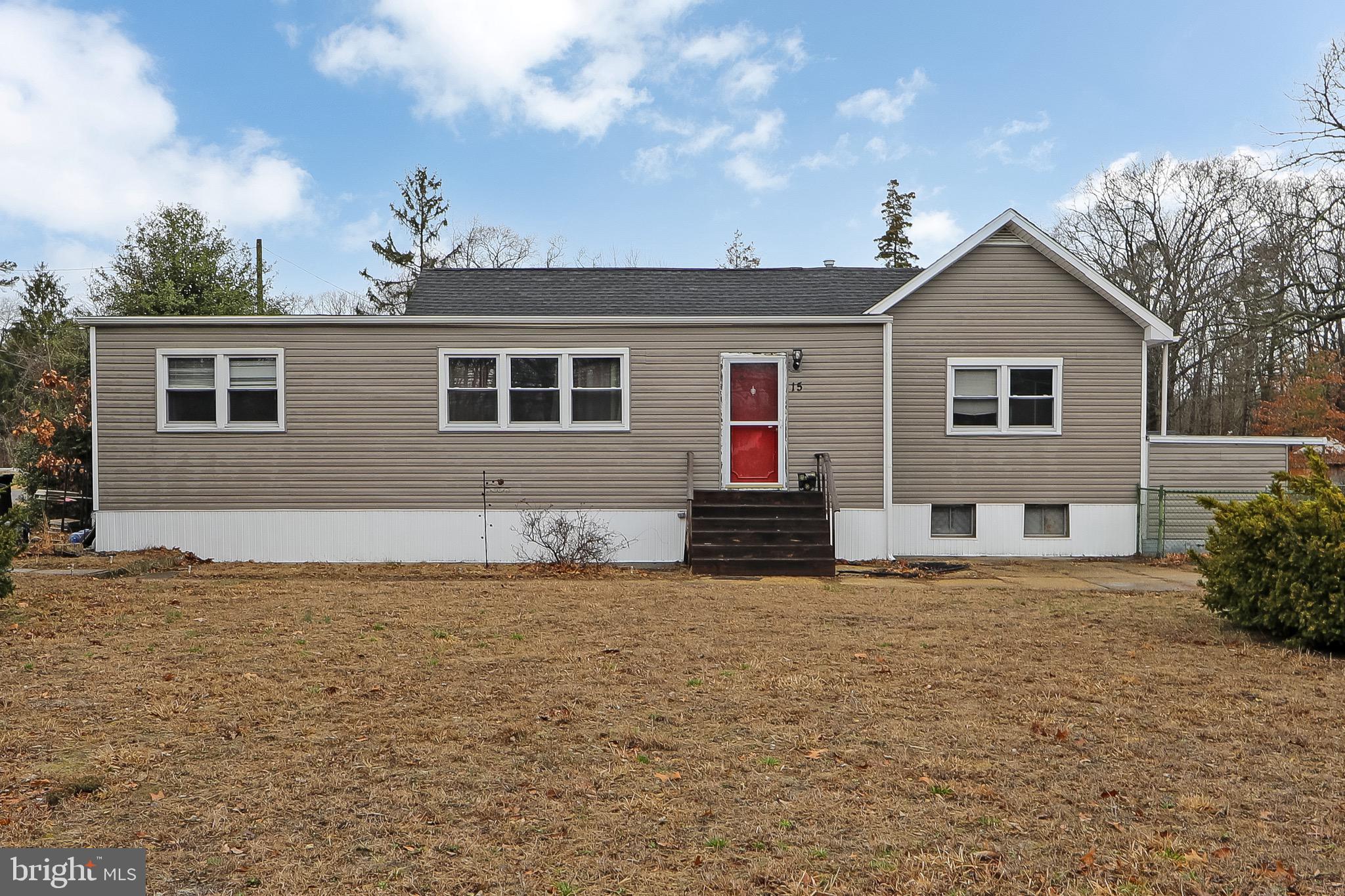 15 East Spring Street Pine Hill, NJ 08021 - Photo 1 of 38 a house that has a big yard and large trees
