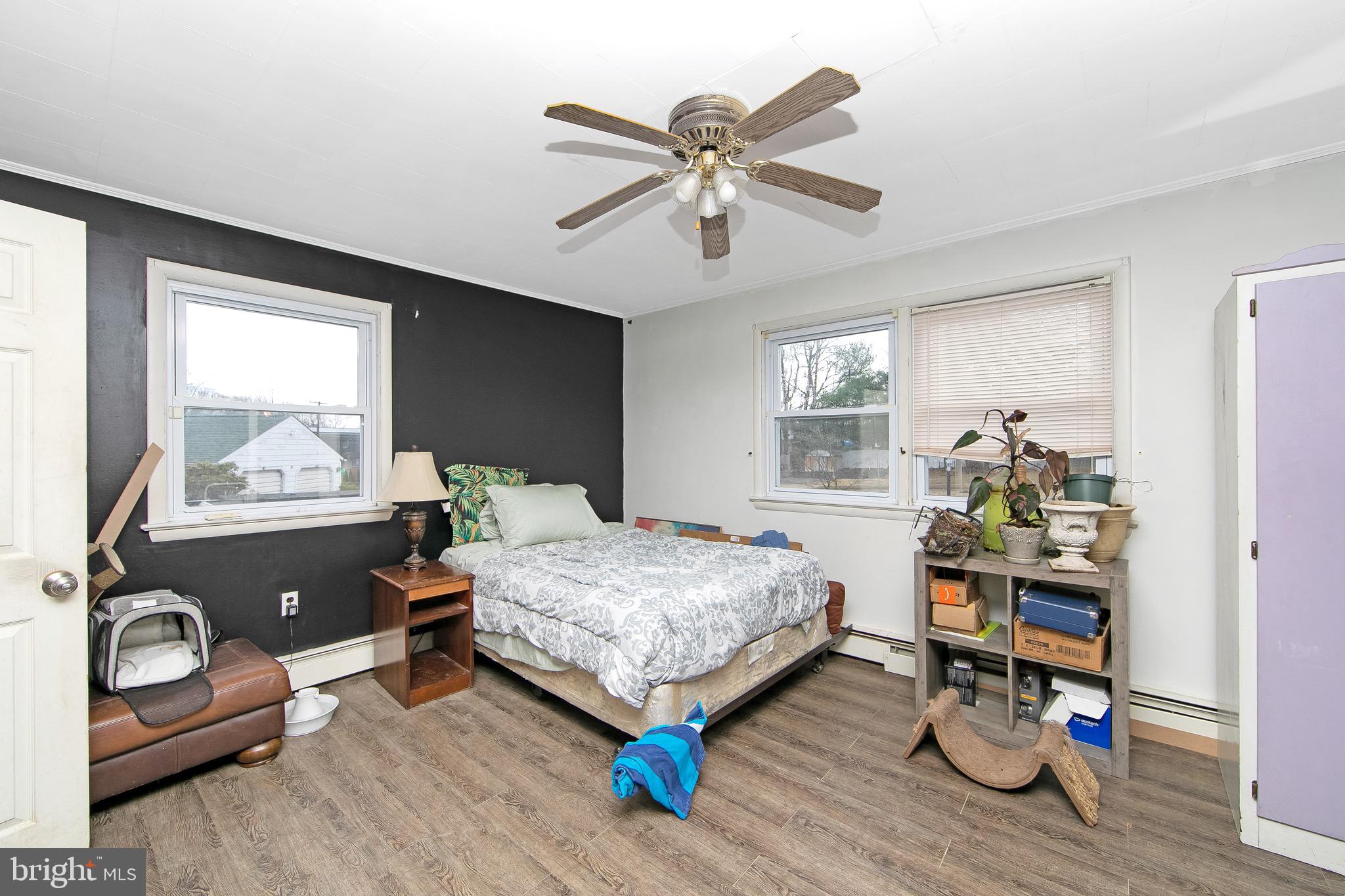 15 East Spring Street Pine Hill, NJ 08021 - Photo 11 of 38 a bedroom with bed and wooden floor