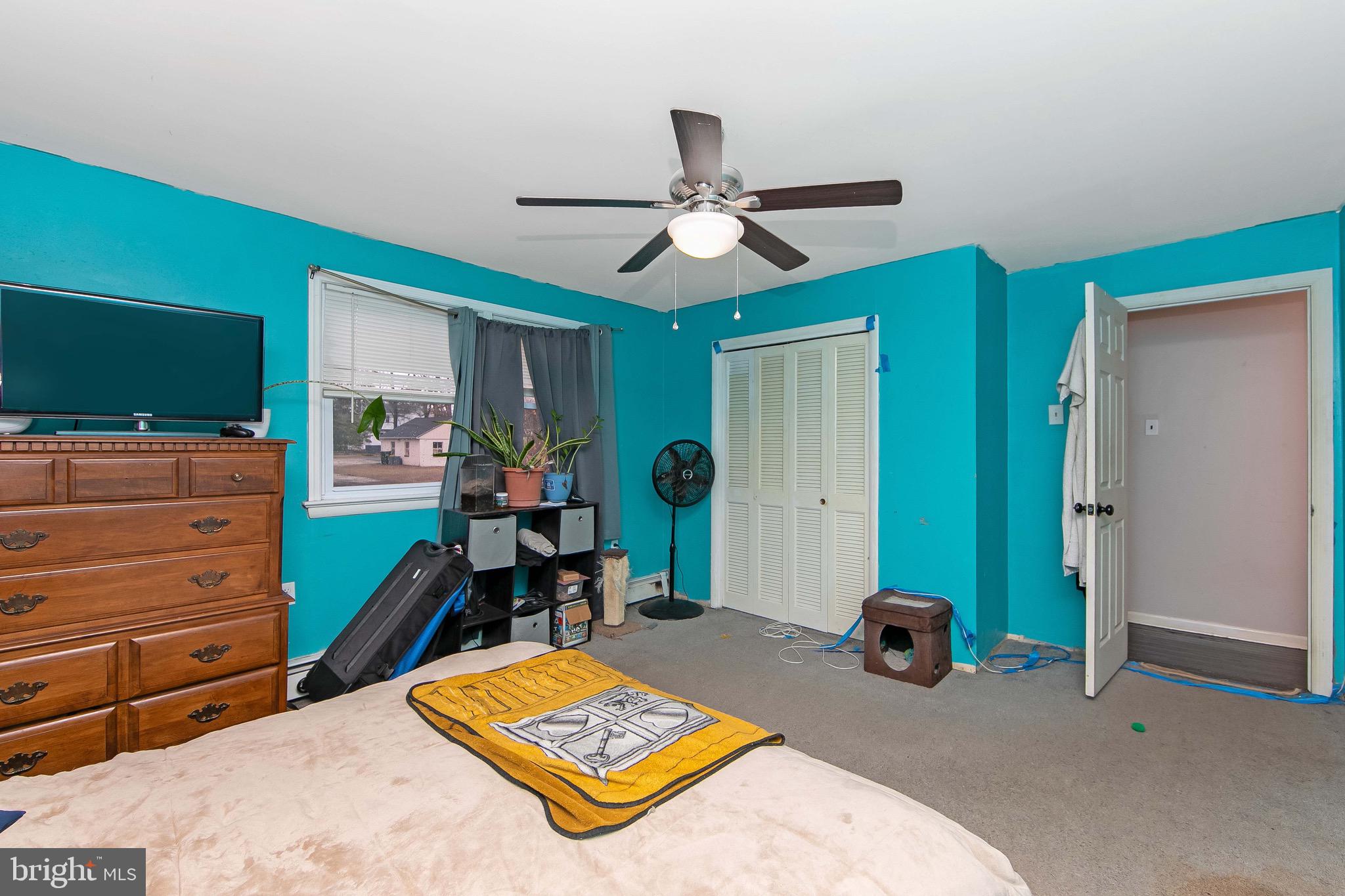 15 East Spring Street Pine Hill, NJ 08021 - Photo 15 of 38 a bed room with a bed and a mirror