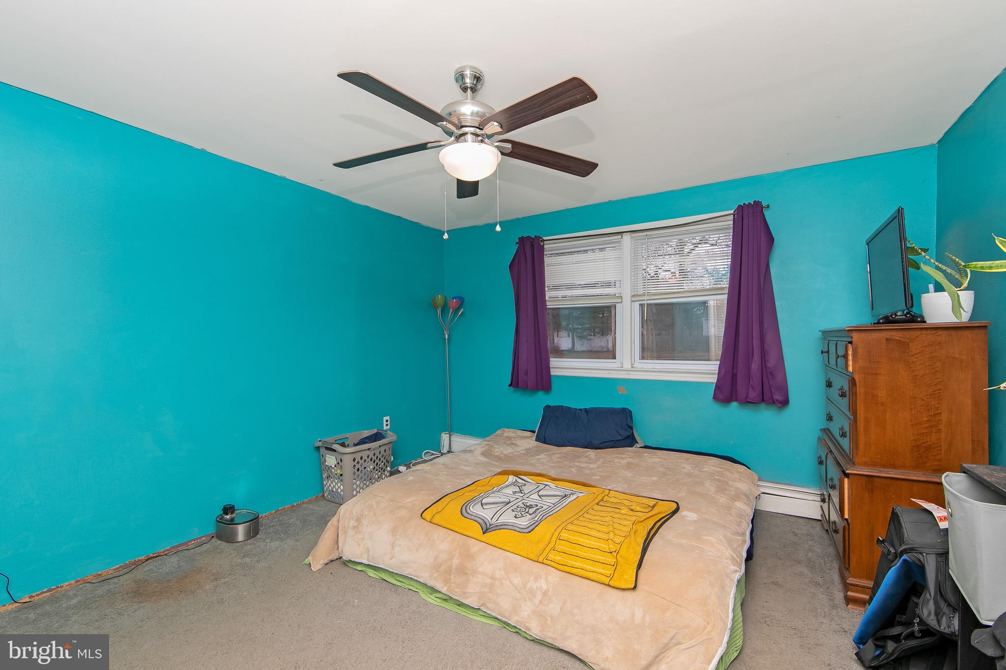 15 East Spring Street Pine Hill, NJ 08021 - Photo 16 of 38 a bedroom with a bed and a window