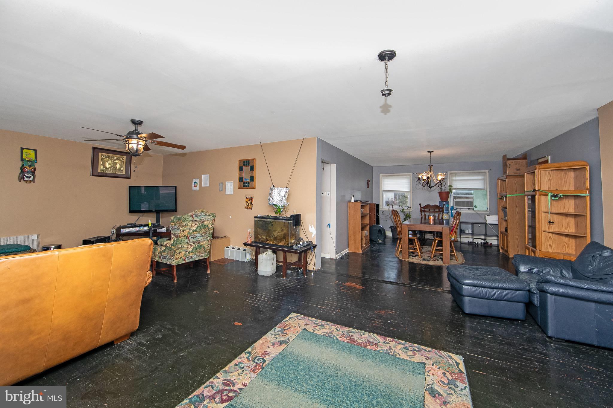 15 East Spring Street Pine Hill, NJ 08021 - Photo 2 of 38 a living room with furniture and wooden floor