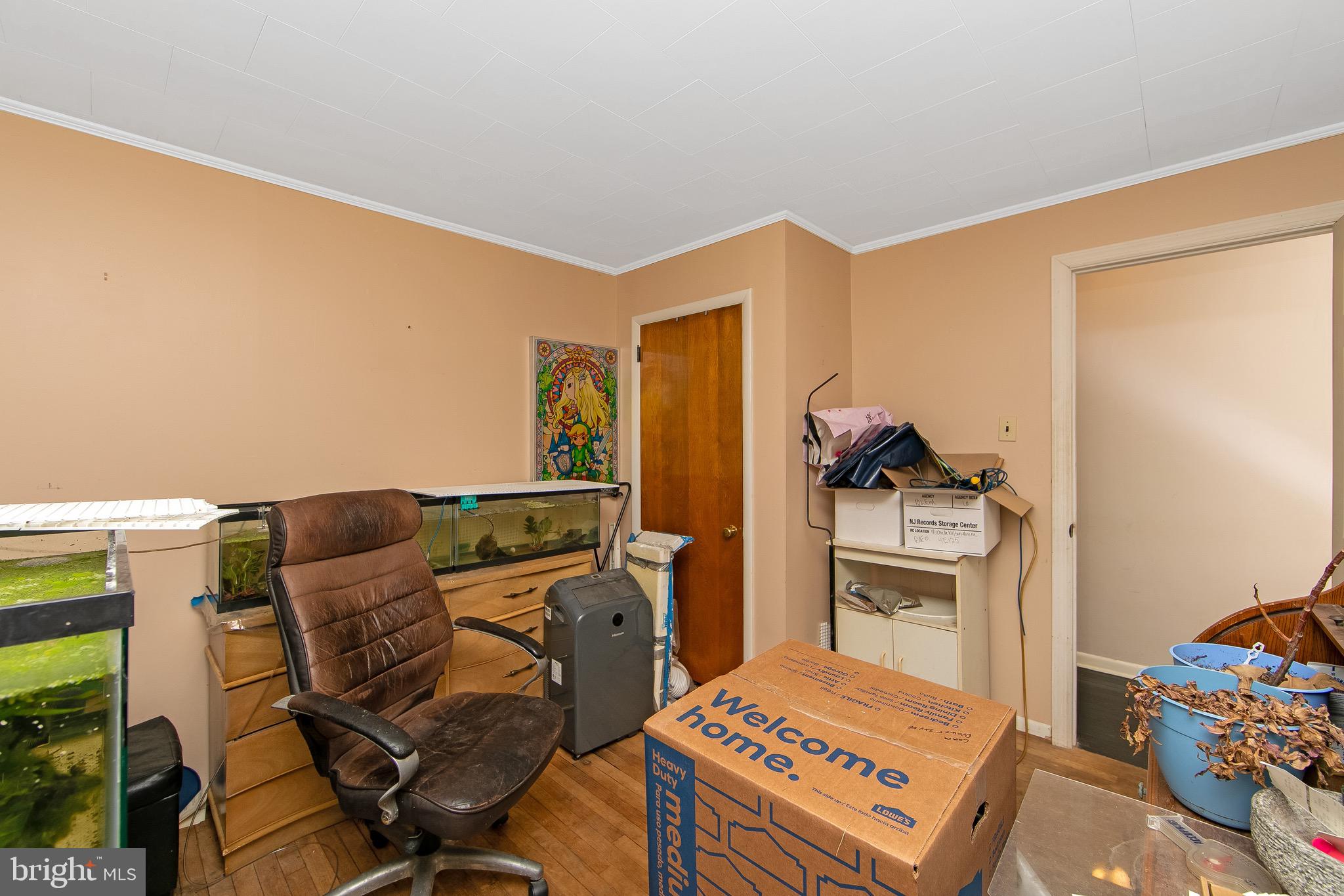 15 East Spring Street Pine Hill, NJ 08021 - Photo 21 of 38 a bedroom with a bed and wooden floor