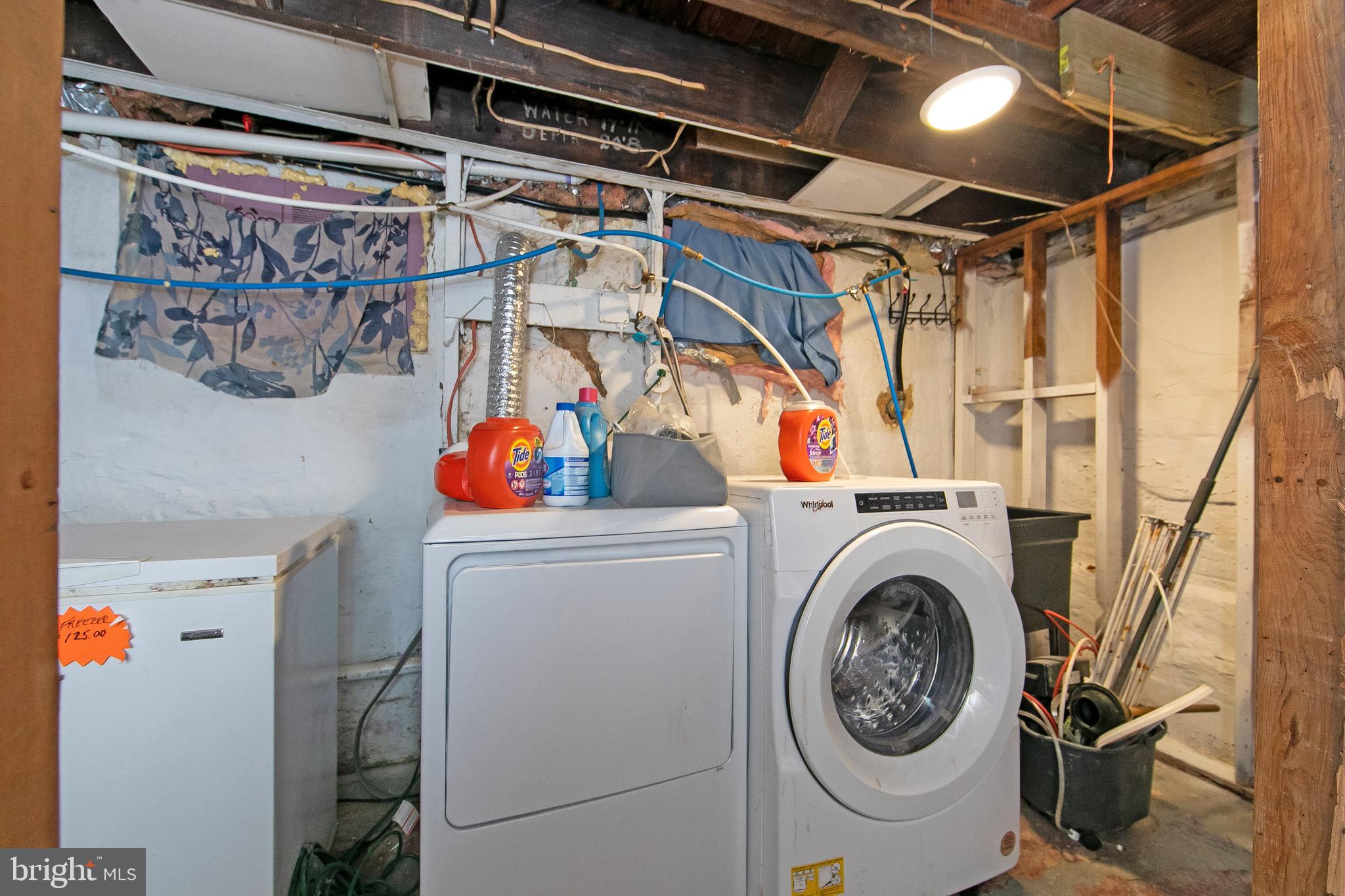 15 East Spring Street Pine Hill, NJ 08021 - Photo 26 of 38 a utility room with dryer and washer