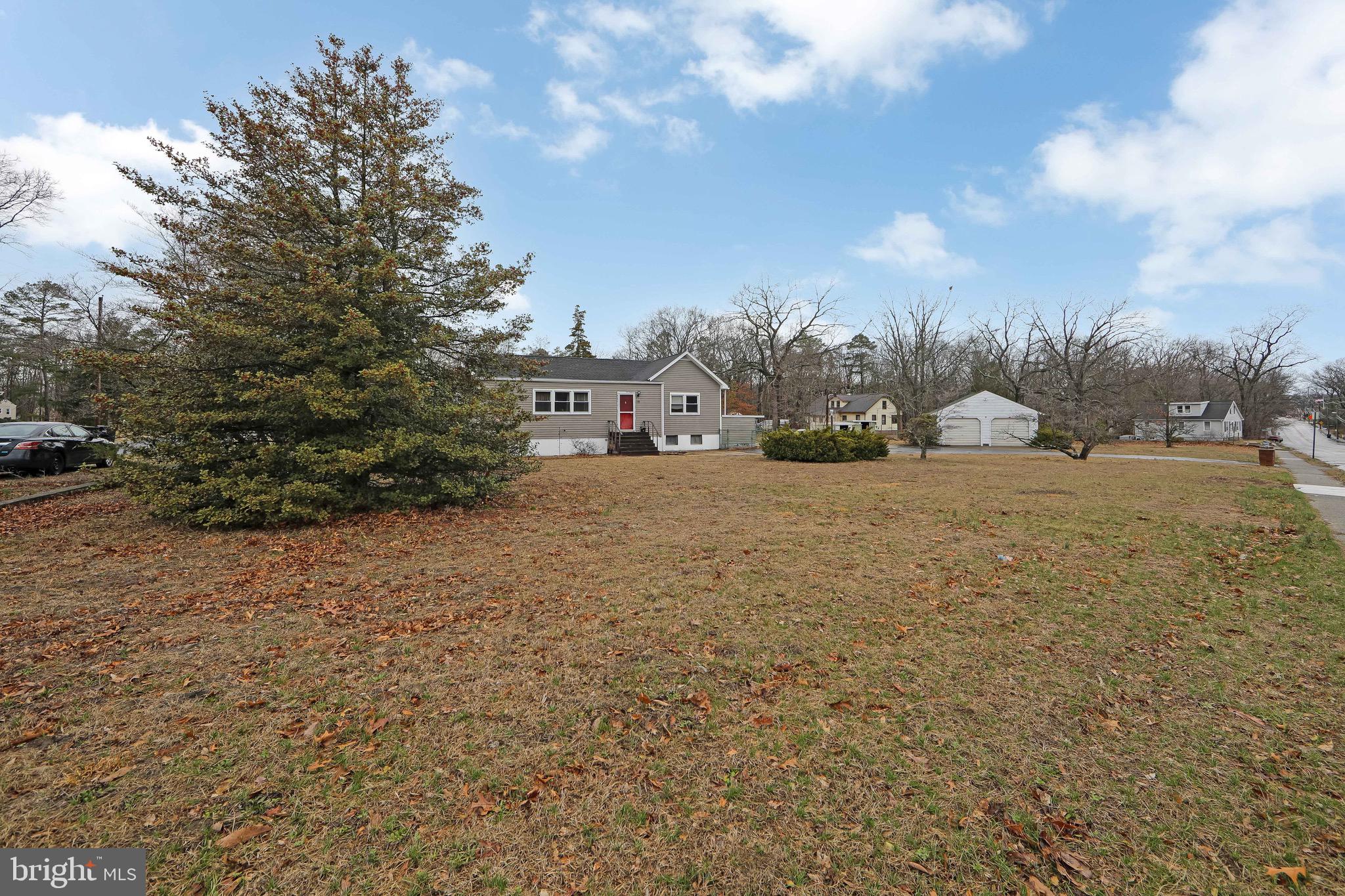 15 East Spring Street Pine Hill, NJ 08021 - Photo 29 of 38 a view of a field with trees in the background