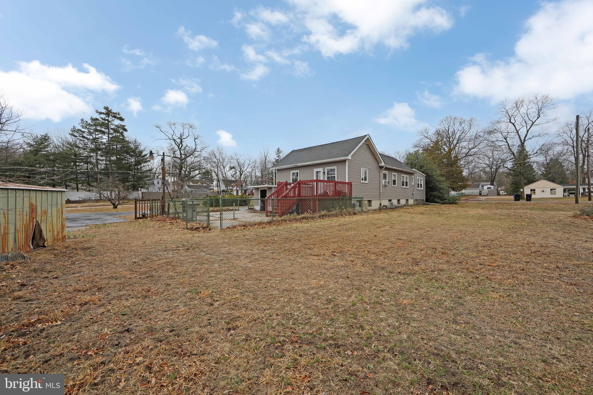 15 East Spring Street Pine Hill, NJ 08021 - Photo 36 of 38 a view of large house with a big yard