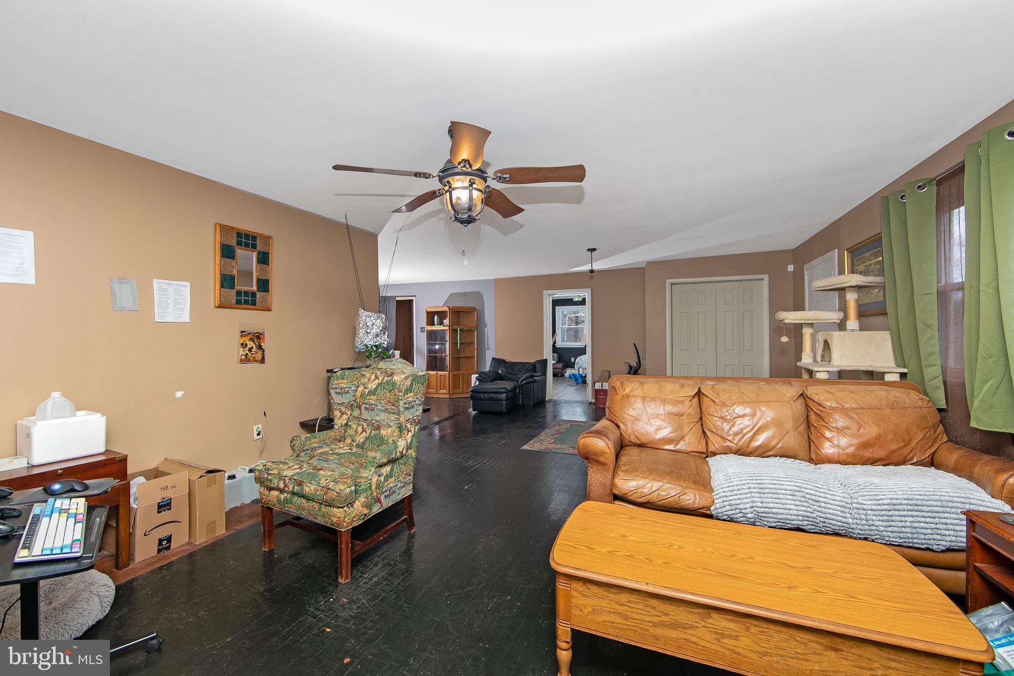 15 East Spring Street Pine Hill, NJ 08021 - Photo 4 of 38 a living room with furniture and a ceiling fan