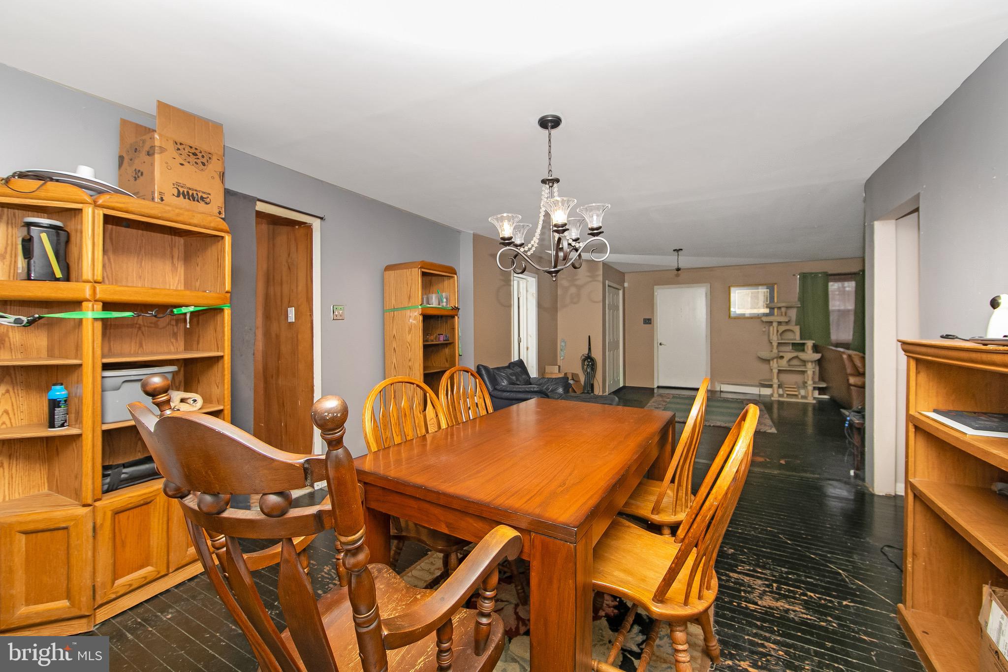 15 East Spring Street Pine Hill, NJ 08021 - Photo 6 of 38 a view of a dining room with furniture and a chandelier