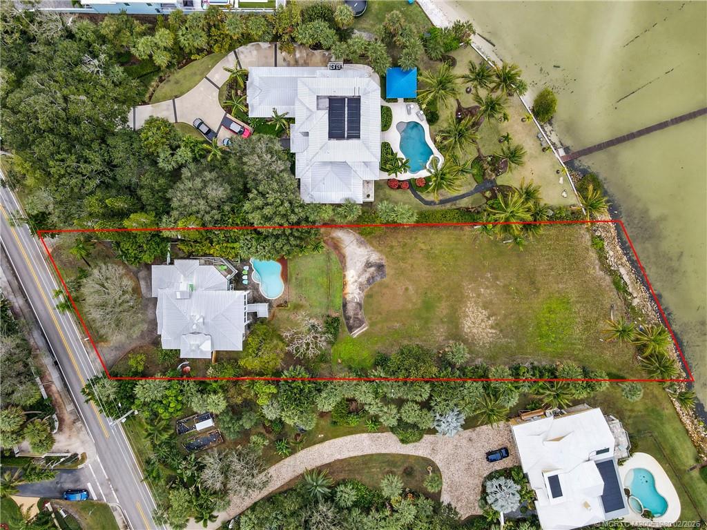 94 North Sewalls Point Road Stuart, FL 34996 - Photo 1 of 35 an aerial view of a house with a garden