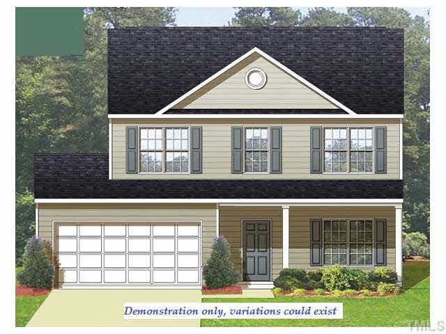 2913 Smooth Stone Trail Raleigh, NC 27610 - Photo 1 of 12 a front view of a house with a yard